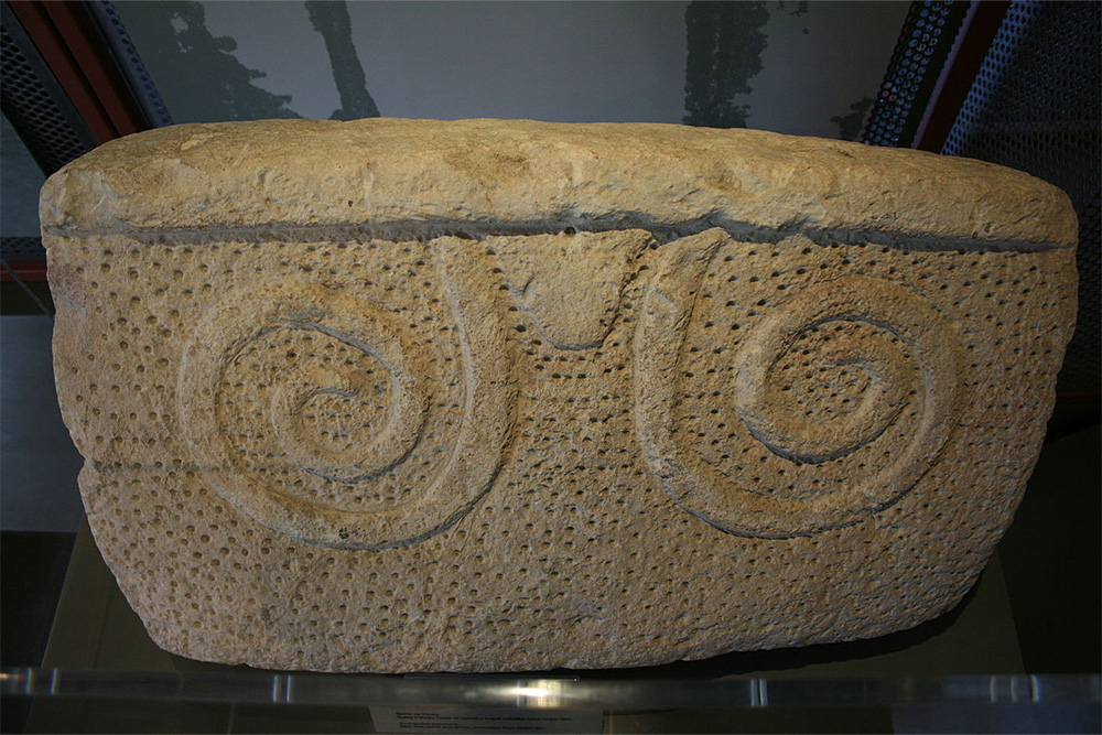 Globigerina limestone - slab with spiral and drilled decoration